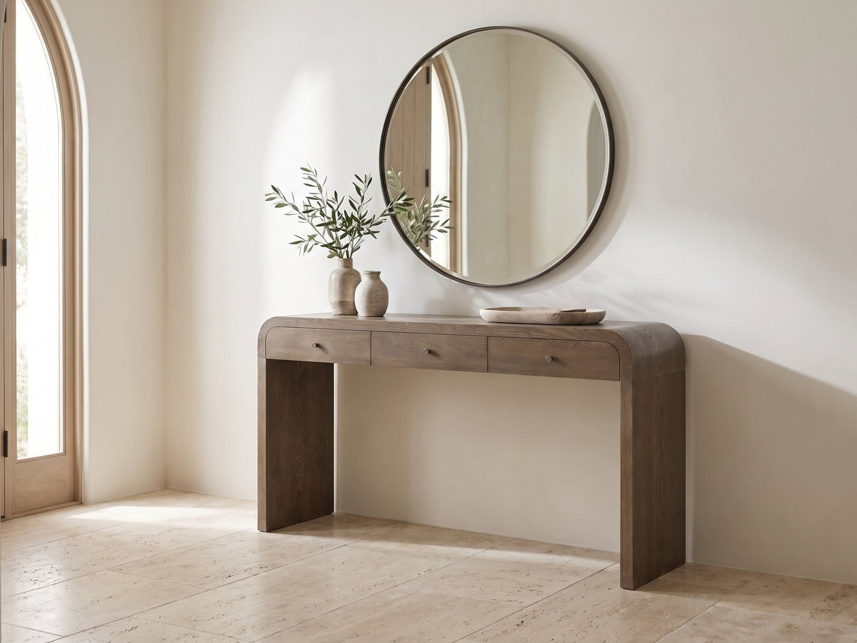 Adelfia Ash Veneer Waterfall Console Table under a round mirror in a travertine entryway