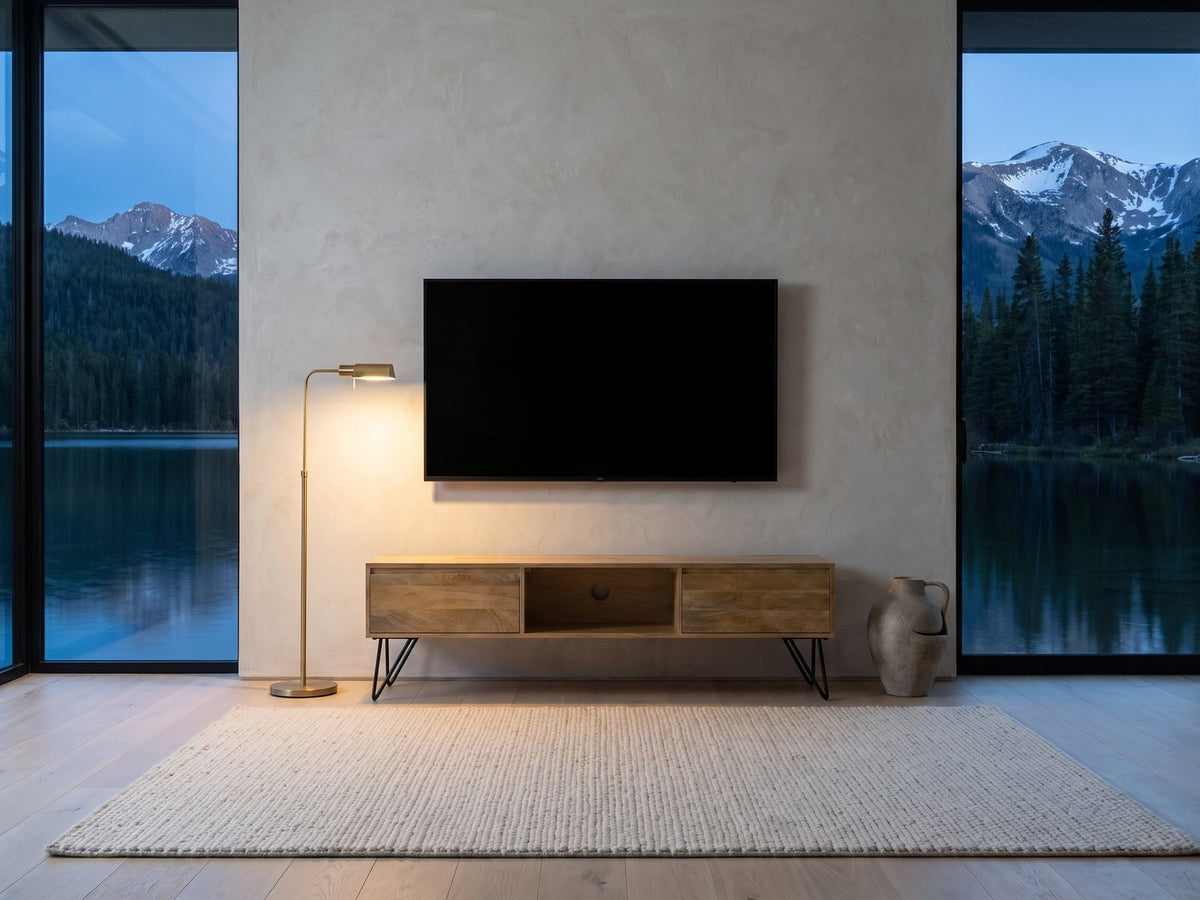 Alberobello Low Mango Media Console under a wall-mounted screen in a mountain lake house at dusk
