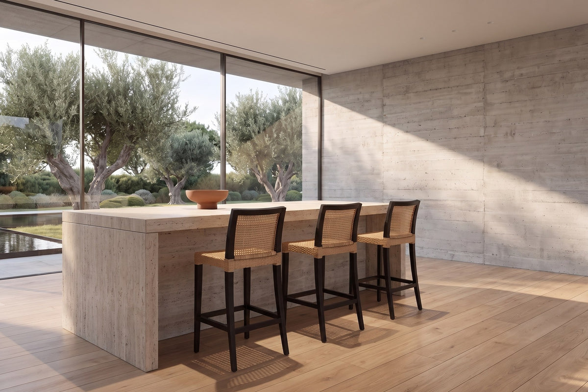 Altilia Open-Weave Rattan and Mahogany Counter Stool in a sunlit villa dining room