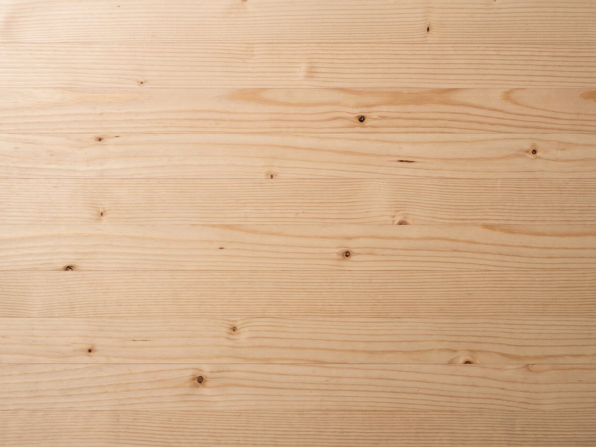 Close-up of the Arona 31.5-Inch Round Solid Fir Storage Drum Coffee Table: the natural fir grain and knots of the top