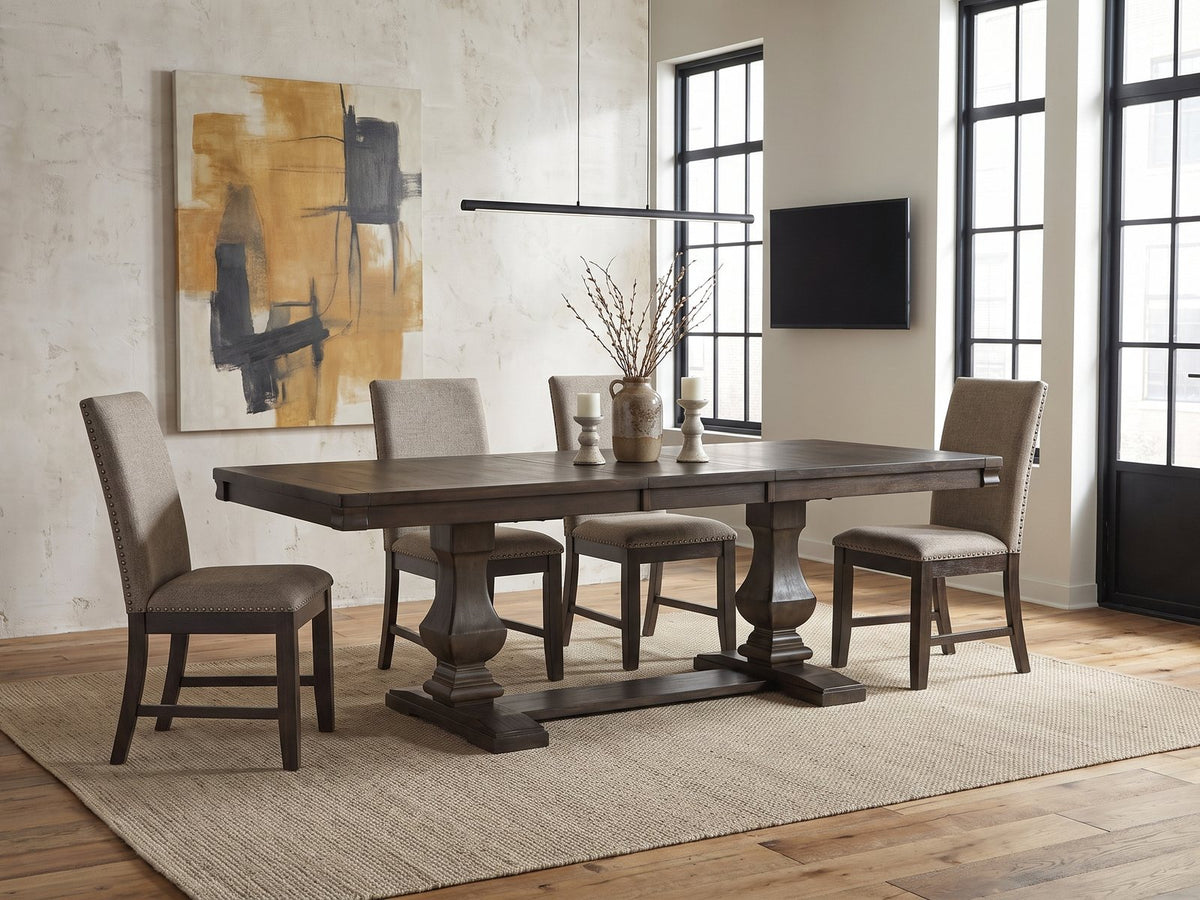 Bagnara 76.5 to 94.5-Inch Rustic Oak Double Pedestal Dining Set with 4 Chairs in an industrial loft dining area