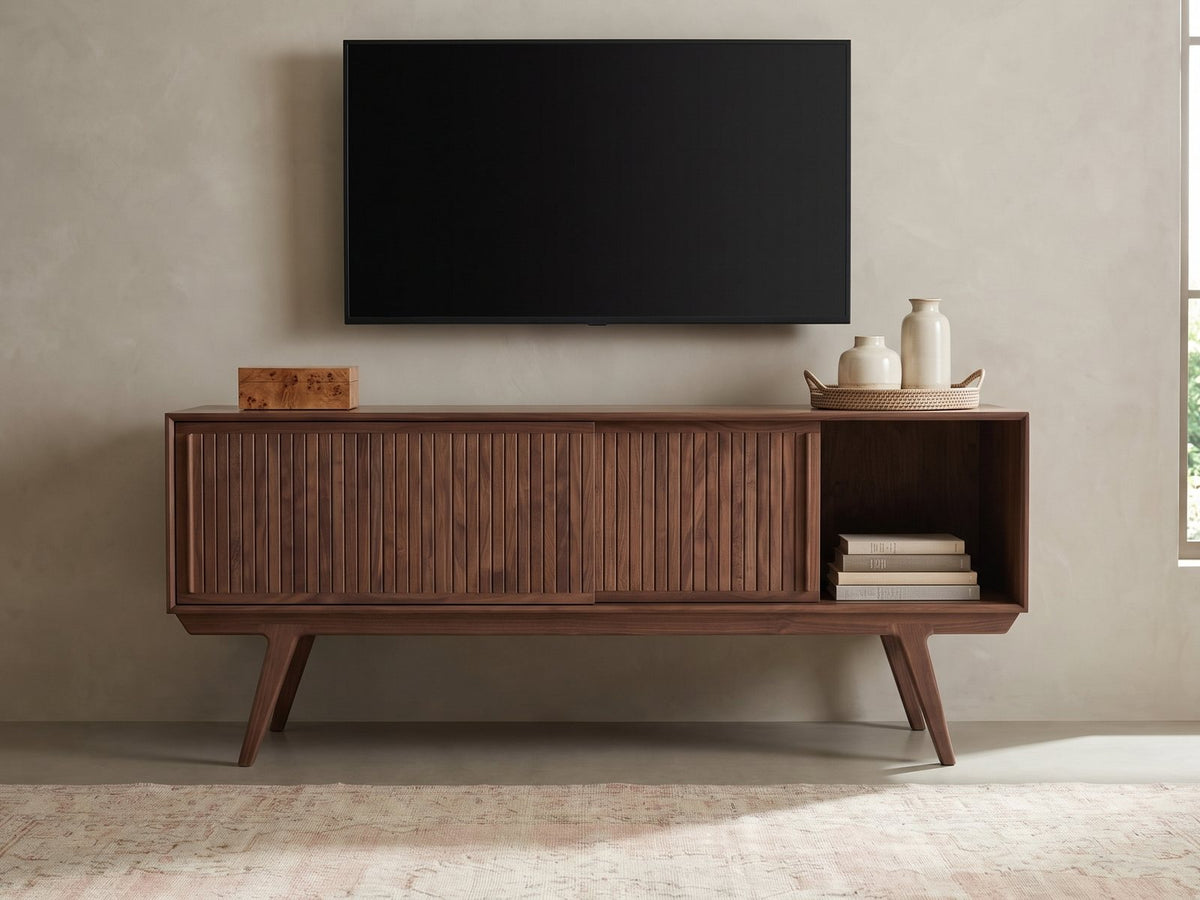 Belluno Solid Walnut Media Cabinet styled with a box, a tray of vases and books under a wall-mounted screen