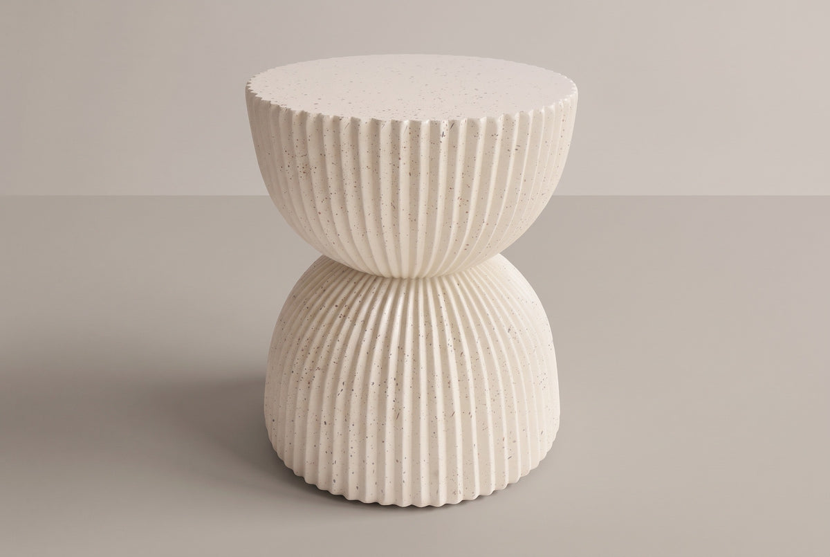 The Bivona beige ribbed hourglass side table, three-quarter view on a light studio backdrop