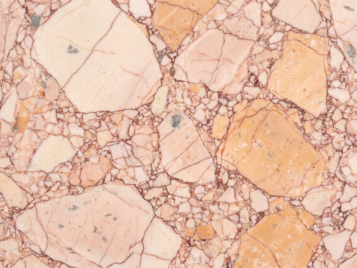 Close-up of the Bojano Rosa Marble Hexagon Side Table: the rosa breccia pattern of the marble top