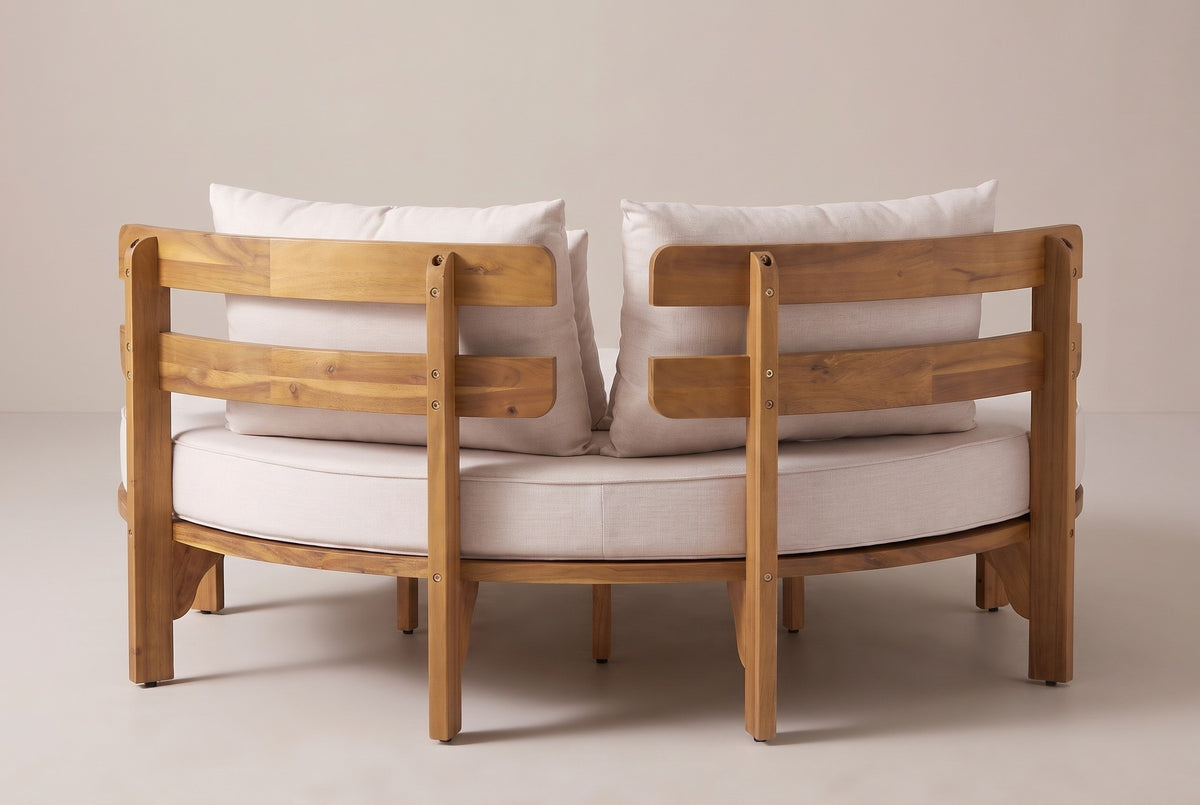 The Butera daybed from behind: two separate curved backrest sections with two slats each, square posts down to the ground