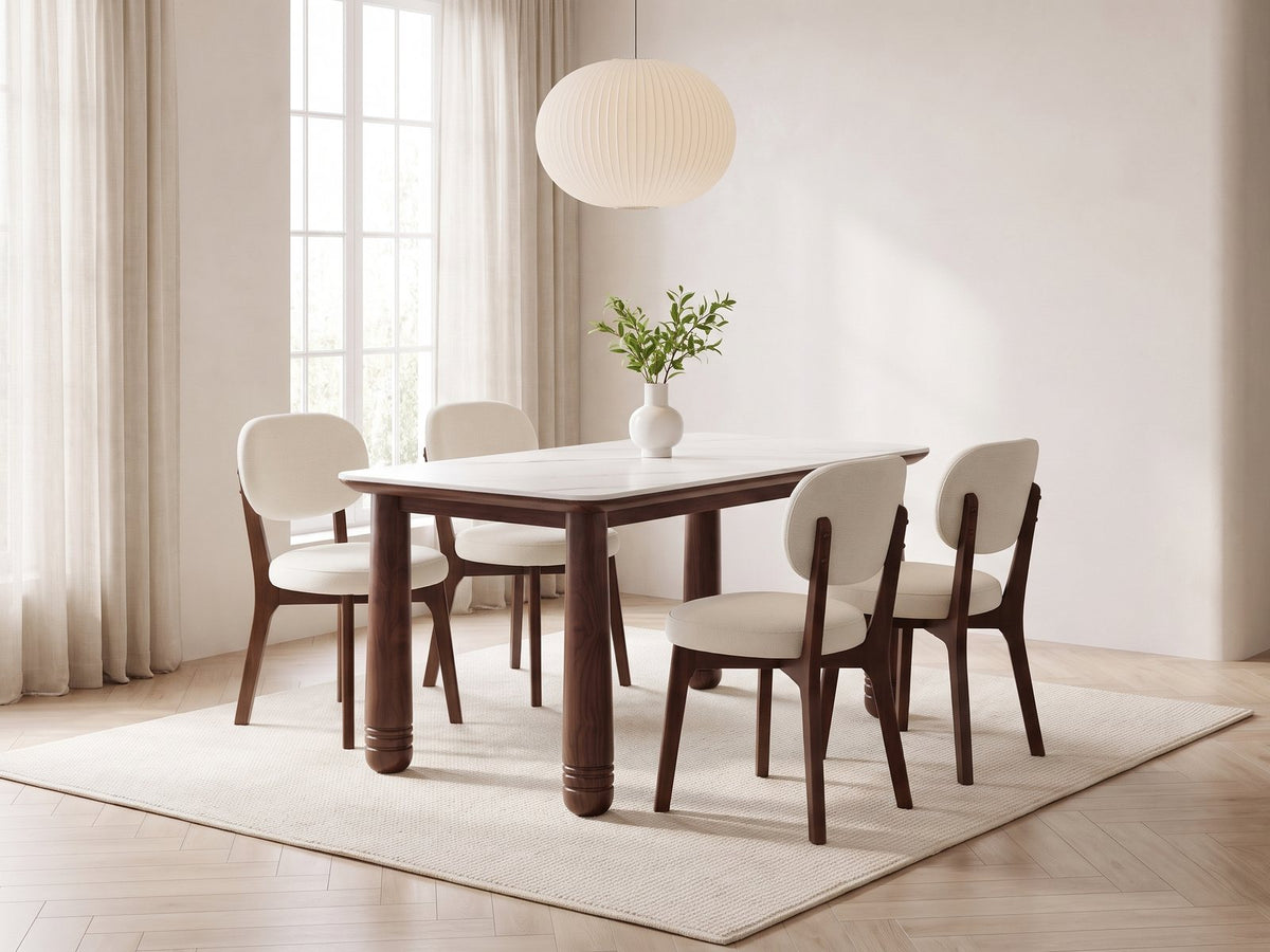 Caccuri 63-Inch Sintered Stone Walnut-Finish Dining Set with 4 Chairs in a bright plaster dining room with linen curtains