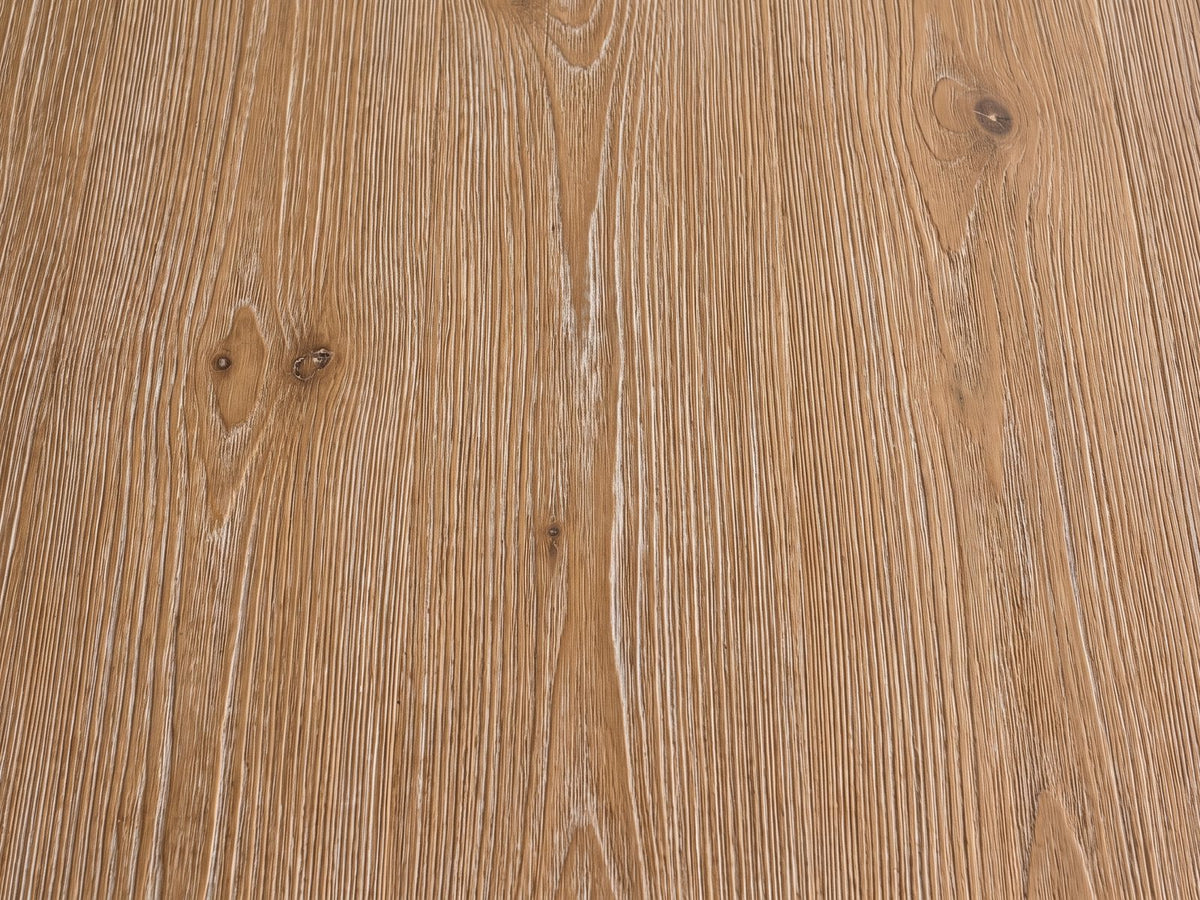 Close-up of the Campli Reclaimed Pine Split Pedestal Side Table: the wire-brushed reclaimed pine grain of the top