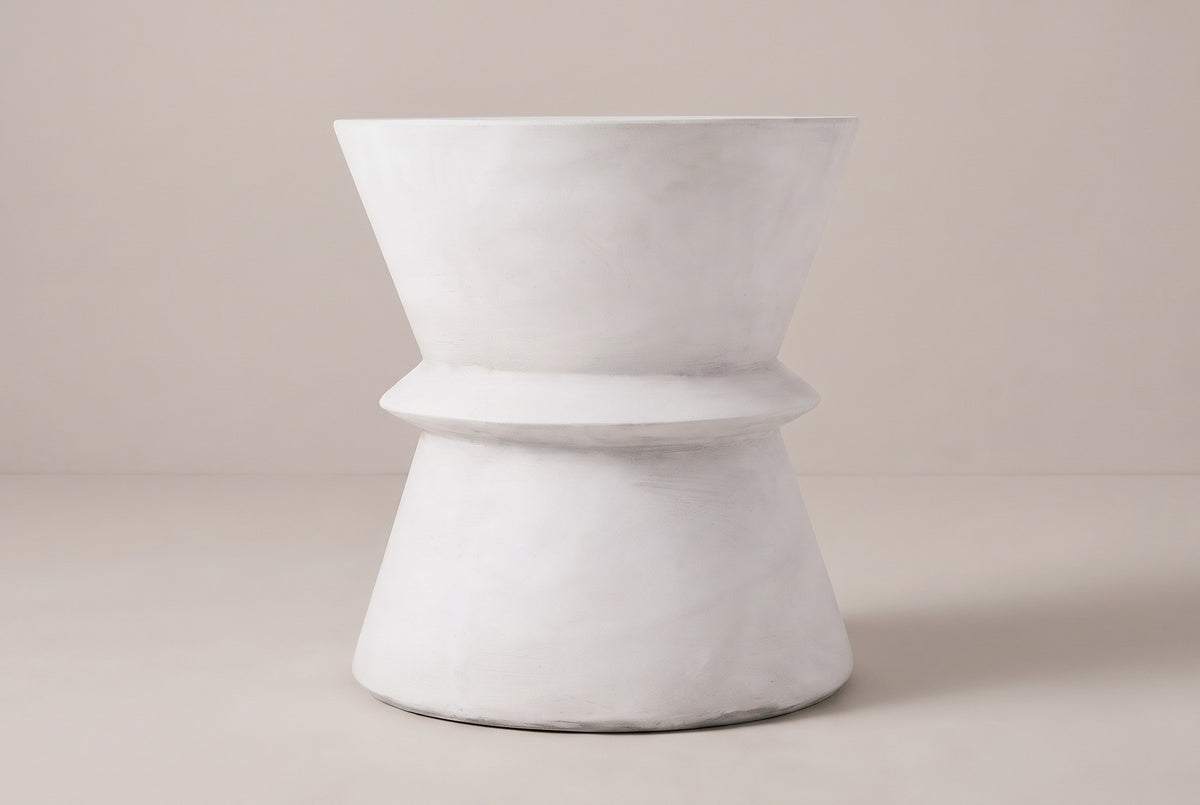 The Capizzi side table seen straight from the side: the upper cone, the ring at the waist and the cone base