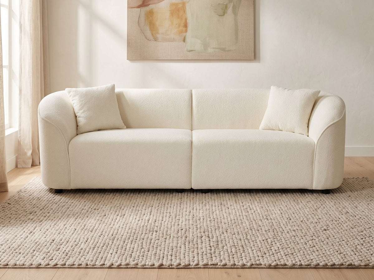 Capri Curved Boucle Sofa in a bright interior
