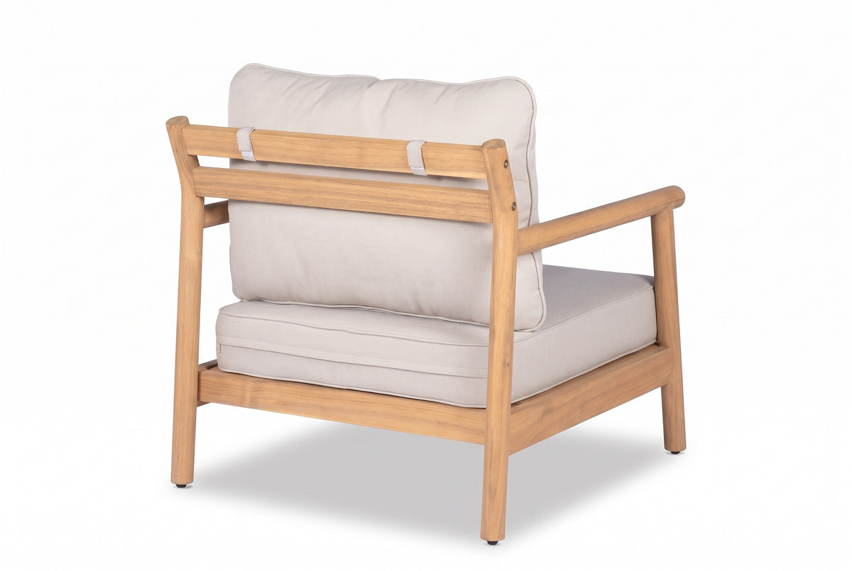 The Caronia chair from behind: two flat acacia slats between round rear posts, the back cushion tied over the top slat