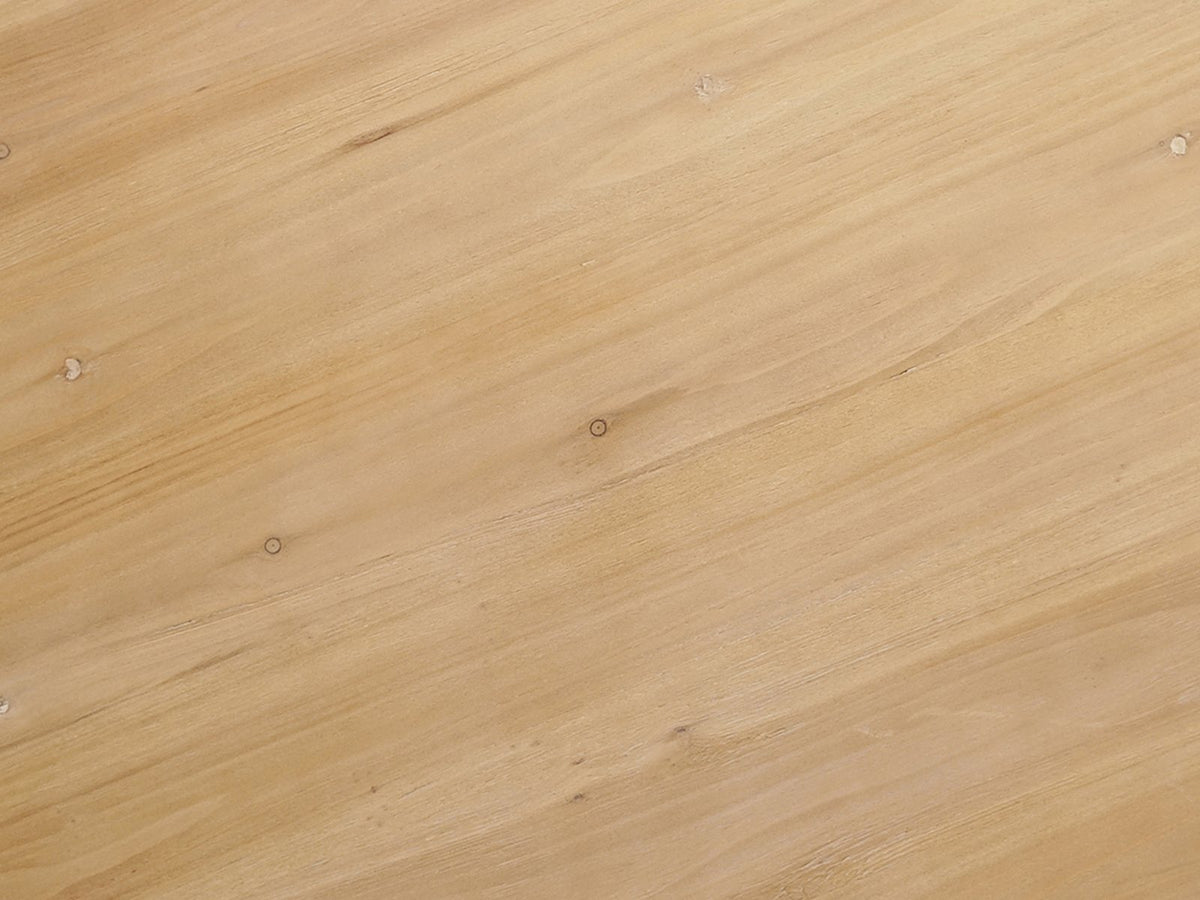 Close-up of the Casabona 42-Inch Round Fir Baluster Pedestal Dining Table: the natural fir top with small knots