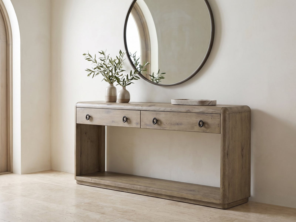 Castellaneta Knotty Oak Veneer Console Table under a round mirror in a travertine entryway