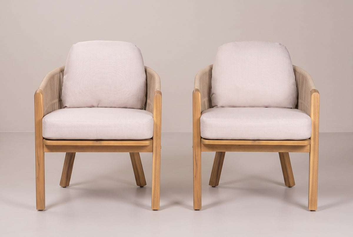 The two Chiaramonte dining armchairs seen from the front: straight acacia front posts, light beige seat cushions on the acacia seat frame and back cushions above the rope