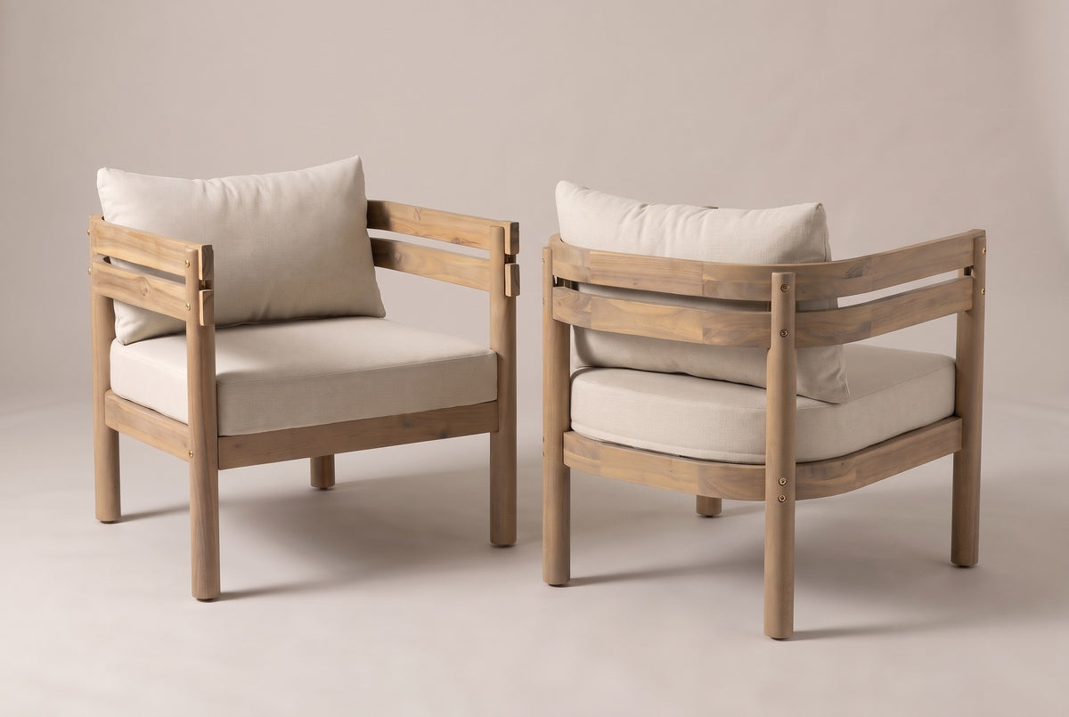The two Cinisi chairs, one seen from the front and one from behind, showing the double acacia rails curving round the back