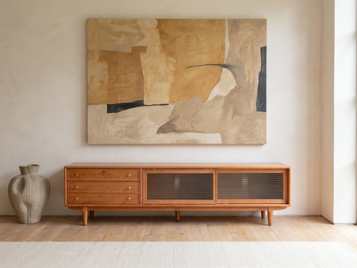 Cividale Solid Cherry Media Console under a large abstract painting in a bright living room