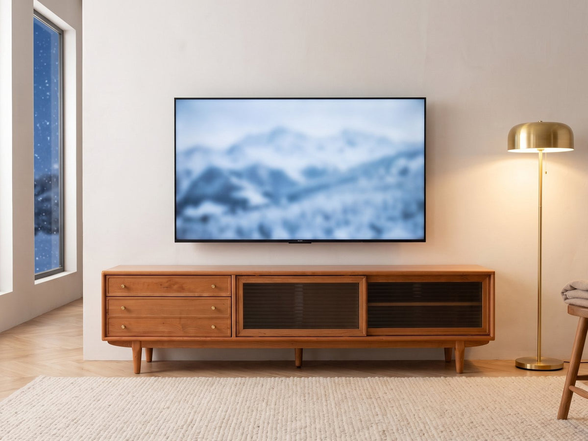 Cividale Solid Cherry Media Console under a screen showing a snowy landscape on a winter evening