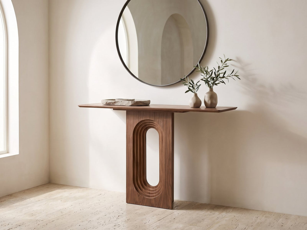 Corato Walnut Veneer Pedestal Console Table under a round mirror in a travertine entryway