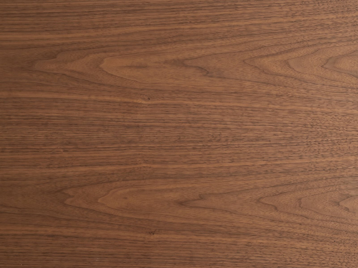 Close-up of the Corato Walnut Veneer Pedestal Console Table: the walnut veneer grain of the top
