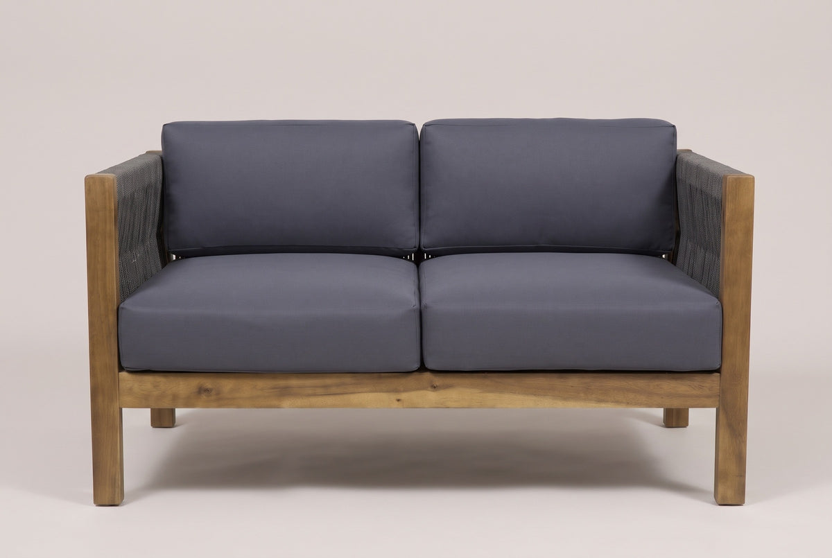 The Corleone loveseat from the front: square acacia posts, rope-woven arms, two seat and two back cushions in dark grey