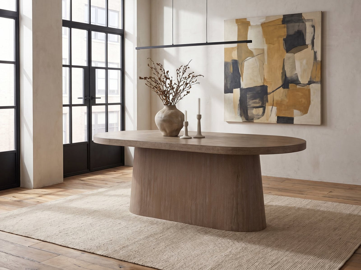 Cotronei 84-Inch Oval Cocoa Wood Veneer Pedestal Dining Table in an industrial loft dining area
