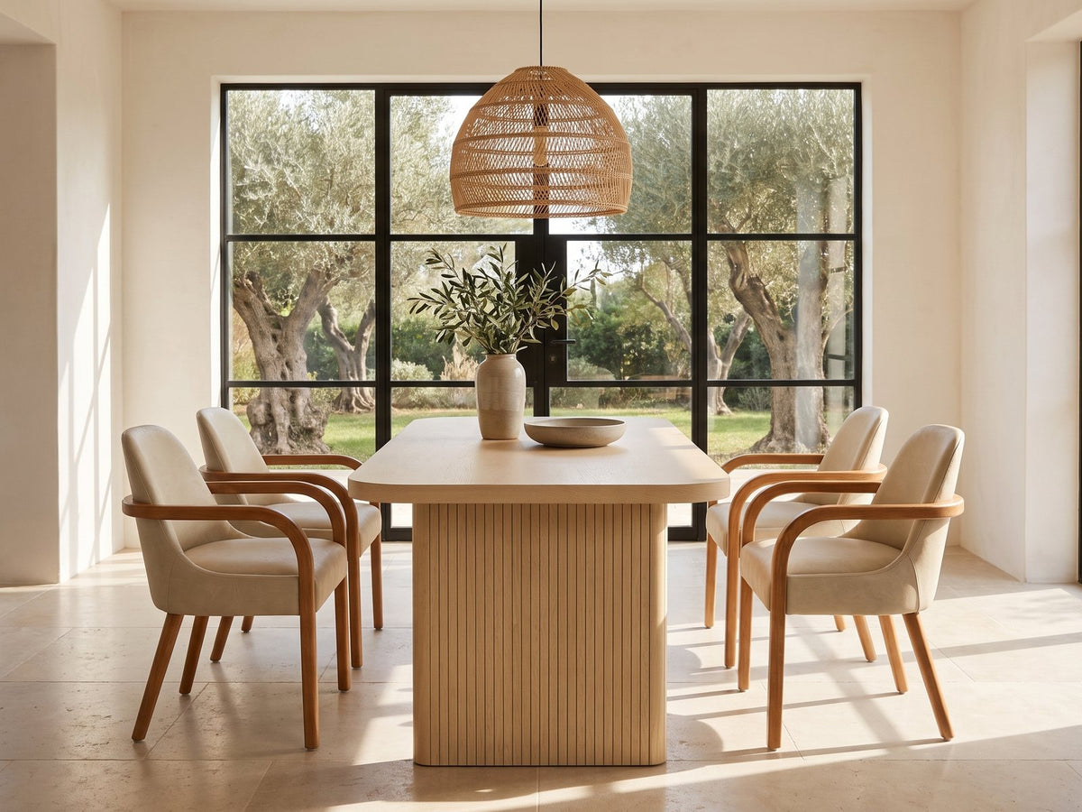 Cropani 69-Inch Rectangular Fluted Dining Set with 4 Arm Chairs in a sunlit villa dining area with olive trees outside