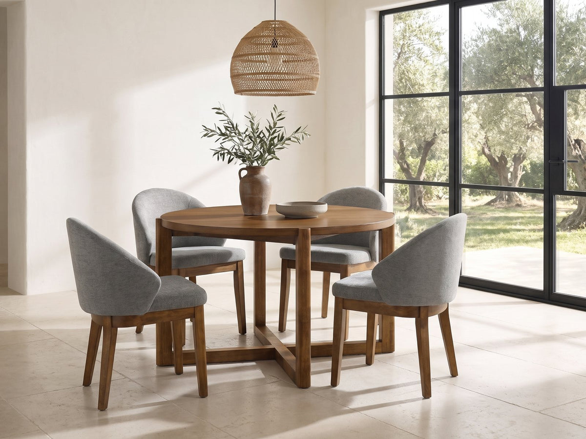 Crucoli 47-Inch Round Walnut-Finish Dining Set with 4 Chairs in a sunlit villa dining area with olive trees outside