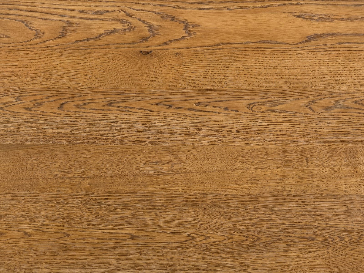 Close-up of the Dogliani 42-Inch Round Walnut-Stained Oak Veneer Coffee Table: the walnut-stained oak veneer of the top
