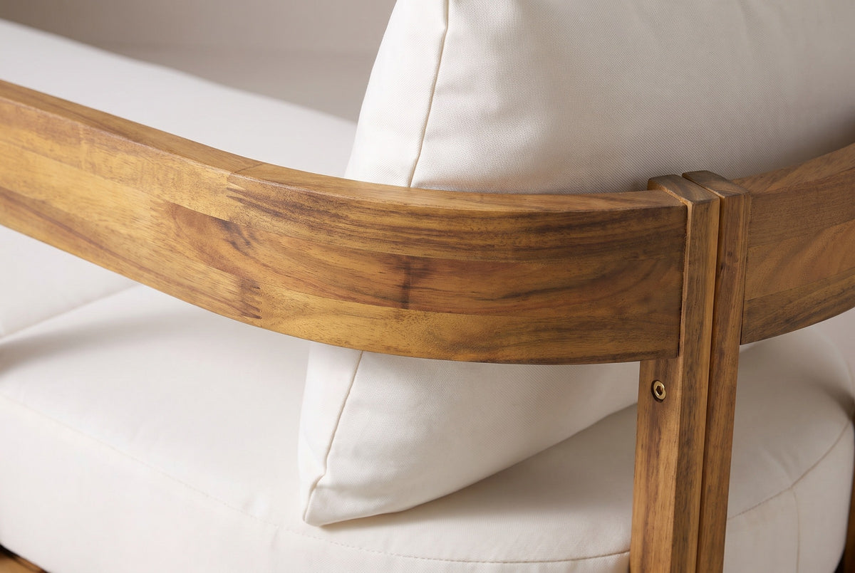 Close-up of the solid acacia on the Favignana chaise: the curved band and a square post in honey teak finish with a brass-coloured bolt head