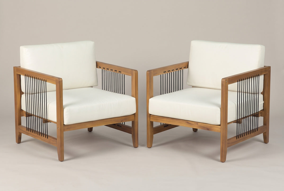 The two Ficarra acacia armchairs with ivory cushions and black rope side panels, three-quarter view on a light studio backdrop