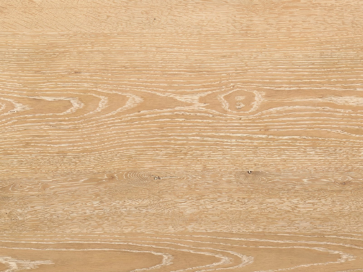 Close-up of the Fiesole Cerused Oak Veneer Round Pedestal Coffee Table: the cerused oak grain of the round top