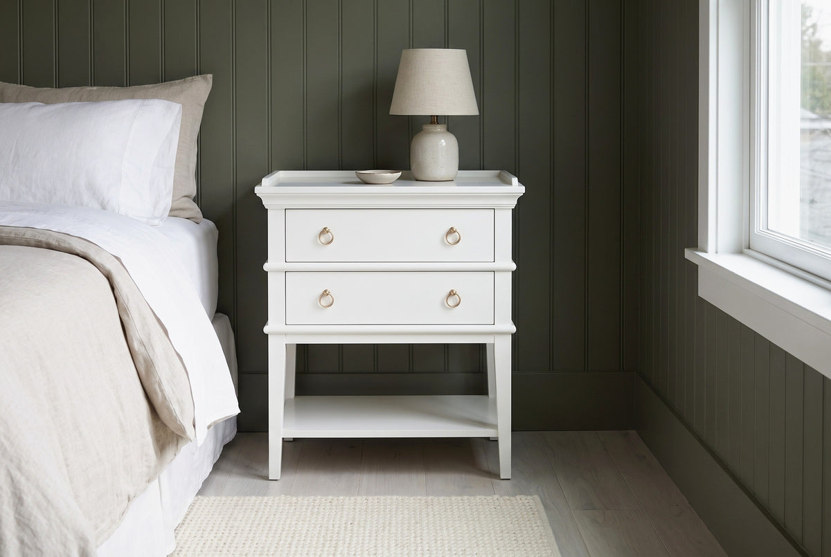 Fonni white tray-top nightstand against sage-green tongue-and-groove boarding in a Seattle Craftsman bedroom with a pale oak floor