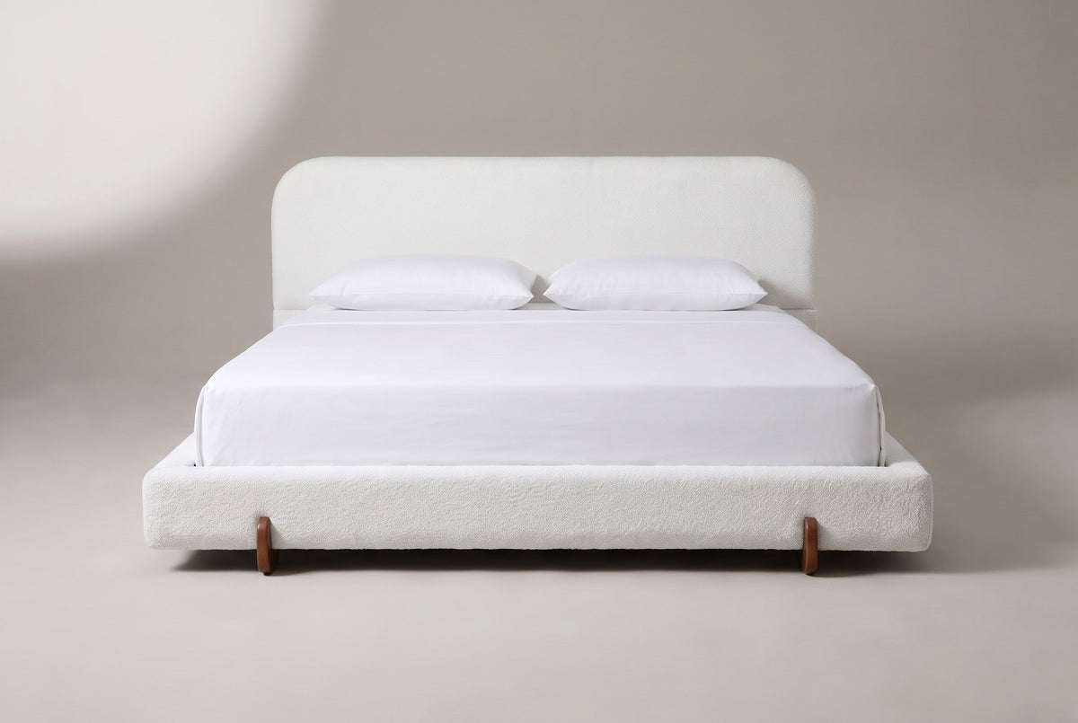 Fossacesia bed in white textured fabric with a white mattress and pillows (not included), front view