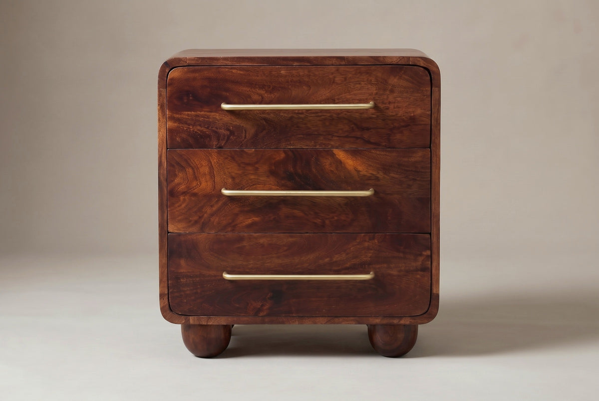 The Galtelli nightstand in chestnut mango, front view on a light studio backdrop