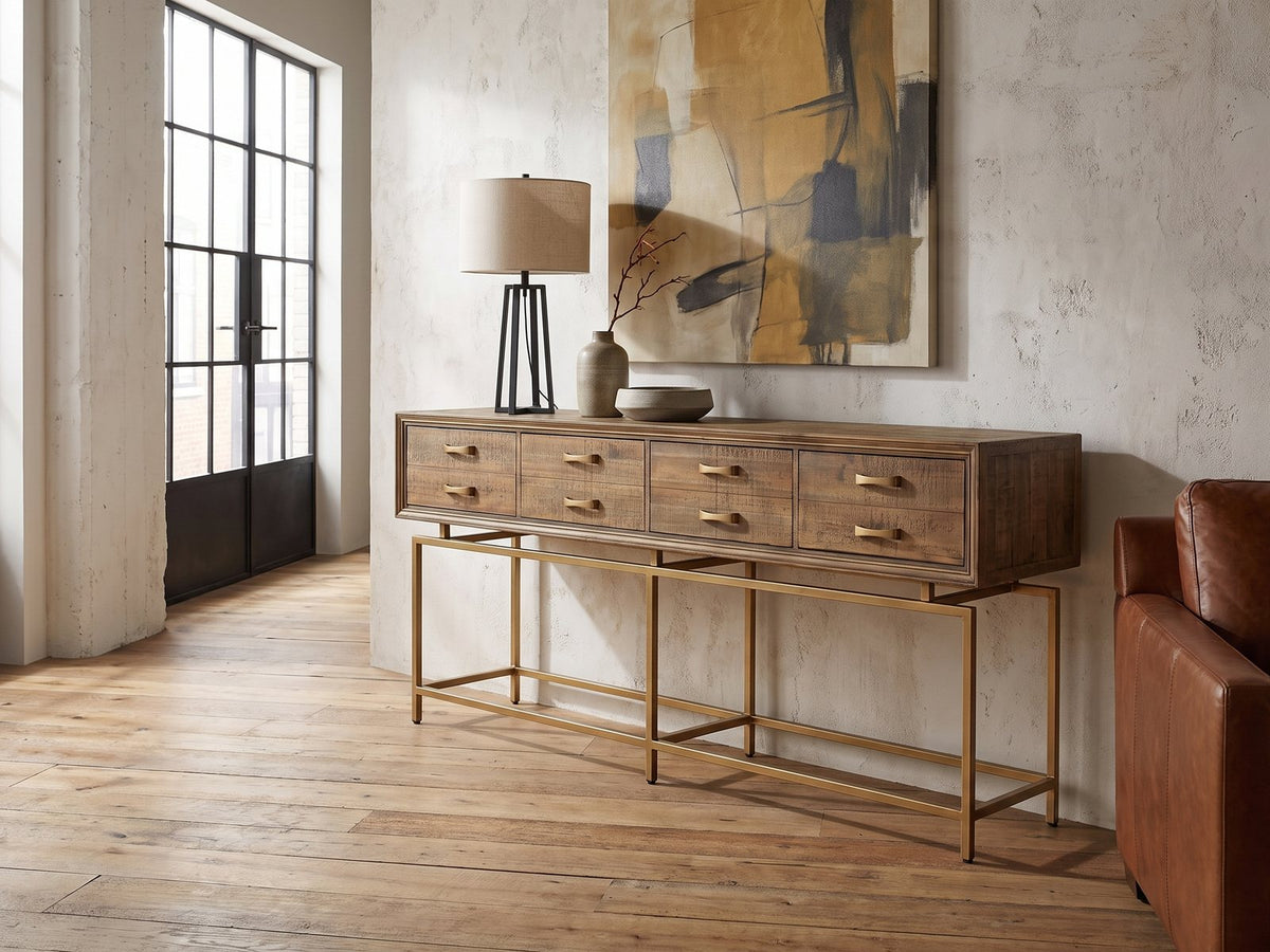 Gasperina Reclaimed Fir Four-Drawer Console Table against a plaster wall in an industrial loft