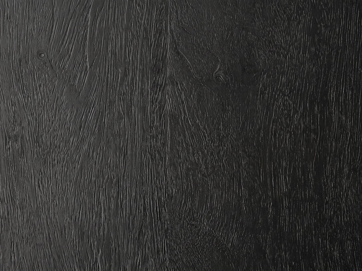 Close-up of the Grottole Black Mango Ribbed Drum Side Table: the black-stained mango grain of the top