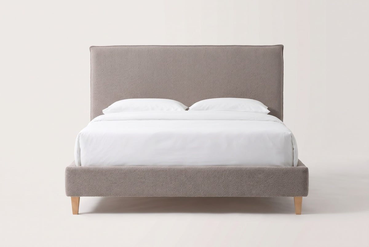Guardiagrele bed in taupe gray boucle with a white mattress and pillows (not included), front view