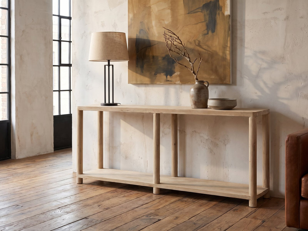 Ivrea Reclaimed Pine Console Table against a plaster wall in an industrial loft