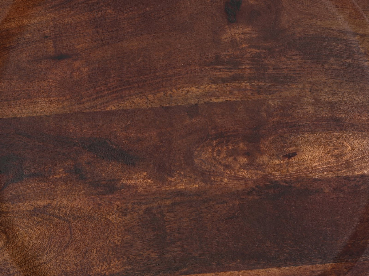 Close-up of the Lagonegro Solid Mango Pedestal Side Table: the dark brown mango grain of the tray top