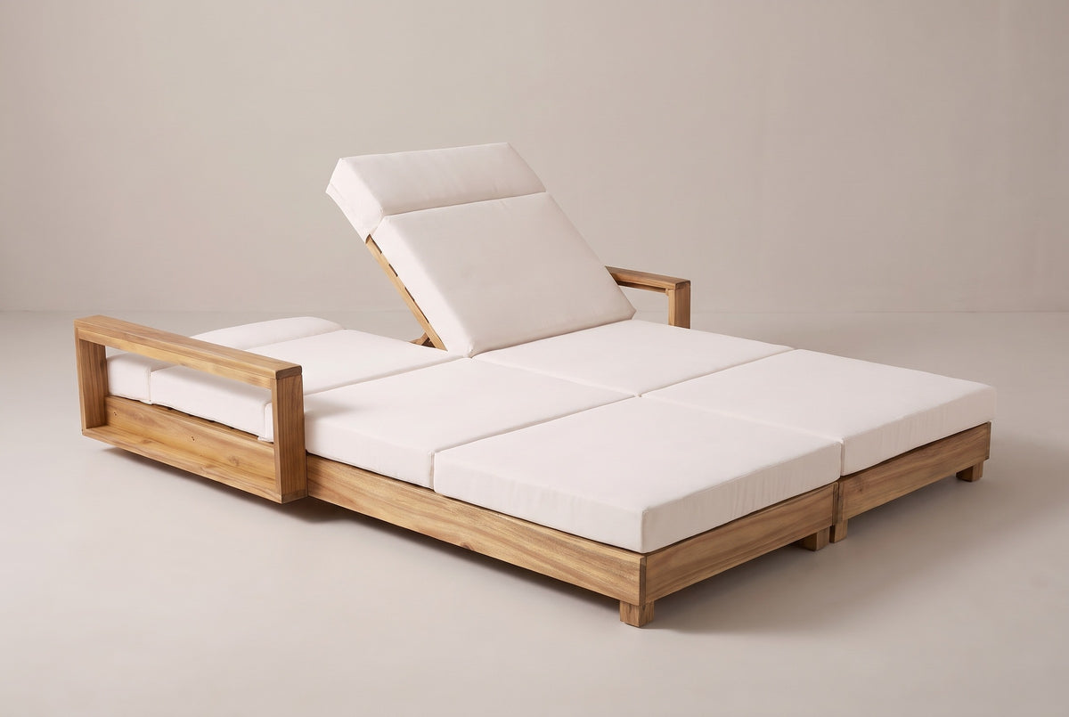 The Lampedusa lounge with one backrest raised and the other lowered flat, three-quarter view on a light studio backdrop