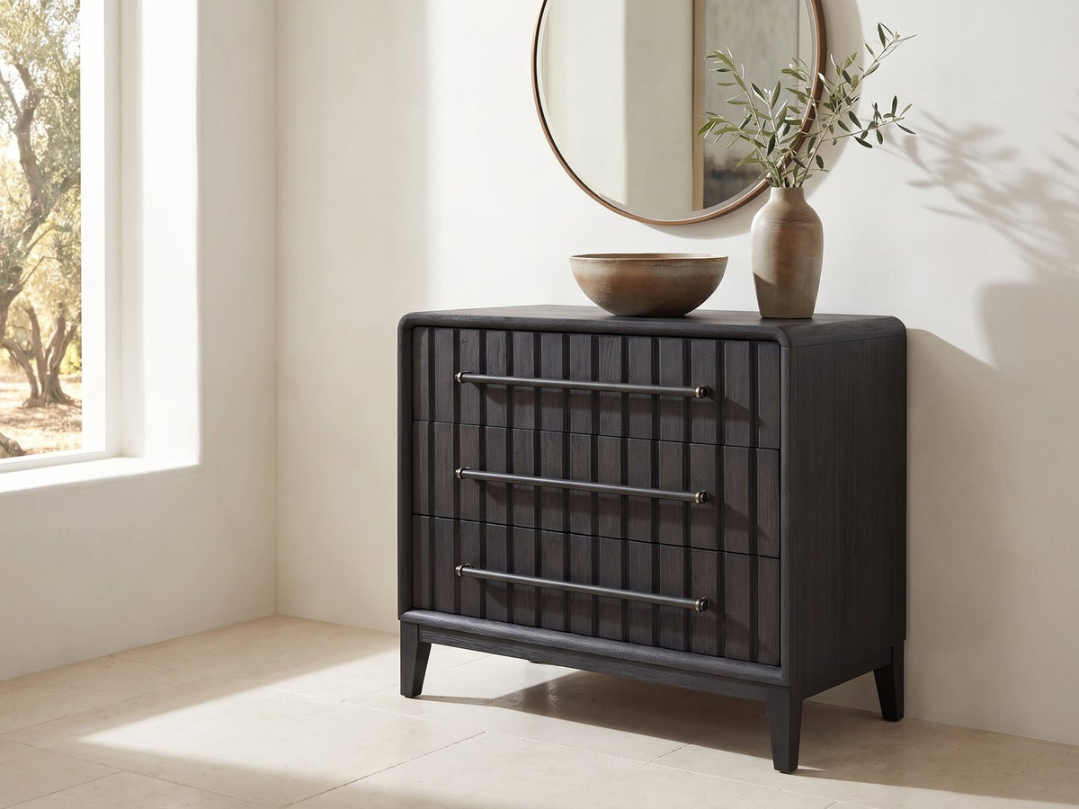Lonigo 38-Inch Peppercorn 3-Drawer Chest under a round bronze mirror in a villa bedroom
