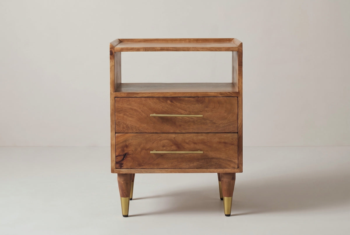 The Mamoiada nightstand in golden-brown mango, front view on a light studio backdrop