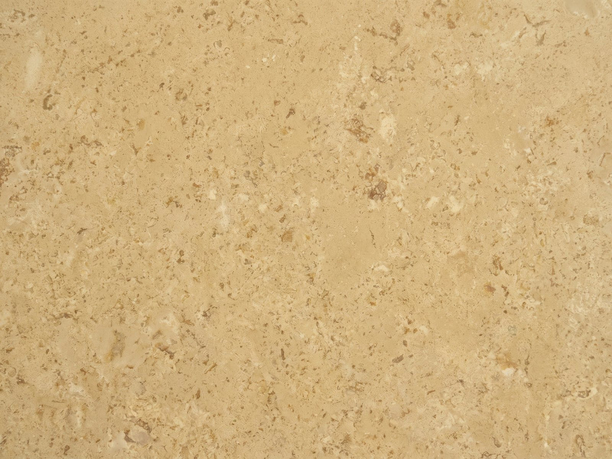 Close-up of the Mantova Gold Beige Marble Nesting Coffee Tables, Set of 2: the veining of the polished gold beige marble