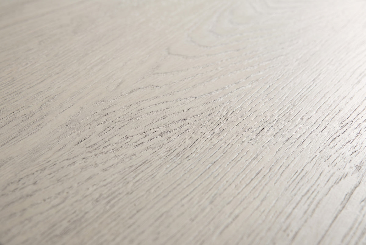Close-up of the Melfi nightstand: wire-brushed gray oak with the open grain showing as fine darker lines