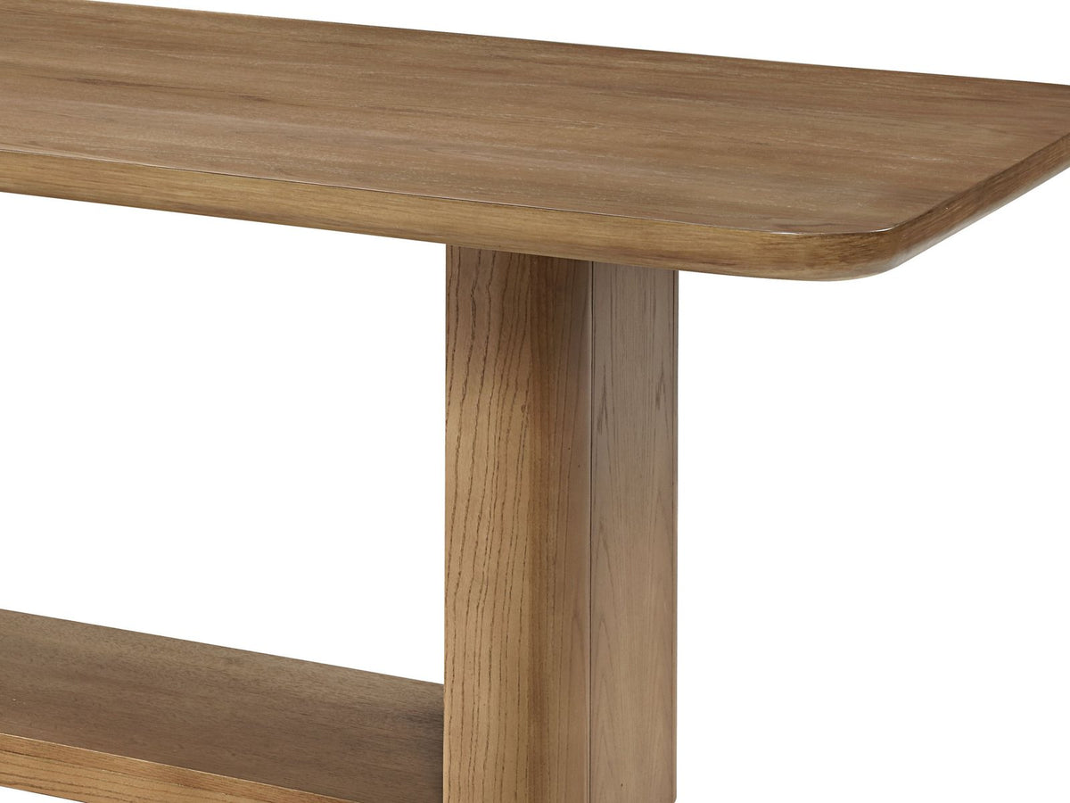 Close-up of the Minturno 95-Inch Light Oak Sled Base Dining Set with 6 Chairs: the rounded-corner oak top and one upright of the loop base