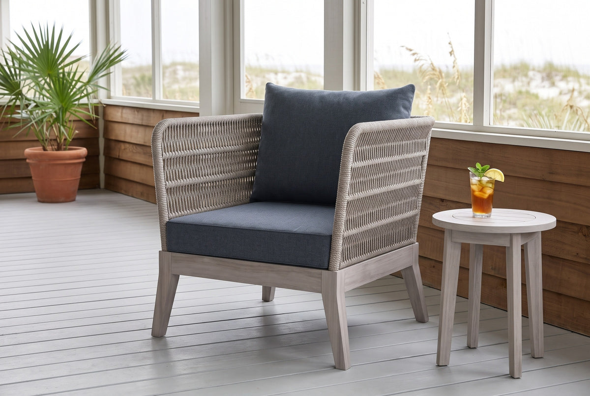 Mistretta rope lounge chair on a screened porch in Rosemary Beach, Florida, with cedar walls, pale grey floorboards and dunes beyond (side table not included)