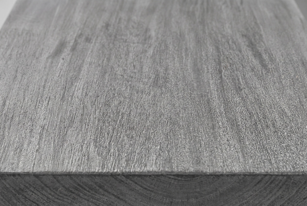 Close-up of the sandblasted grey mango wood on the Molfetta cabinet: long grain lines with a rough, open texture running to a square edge