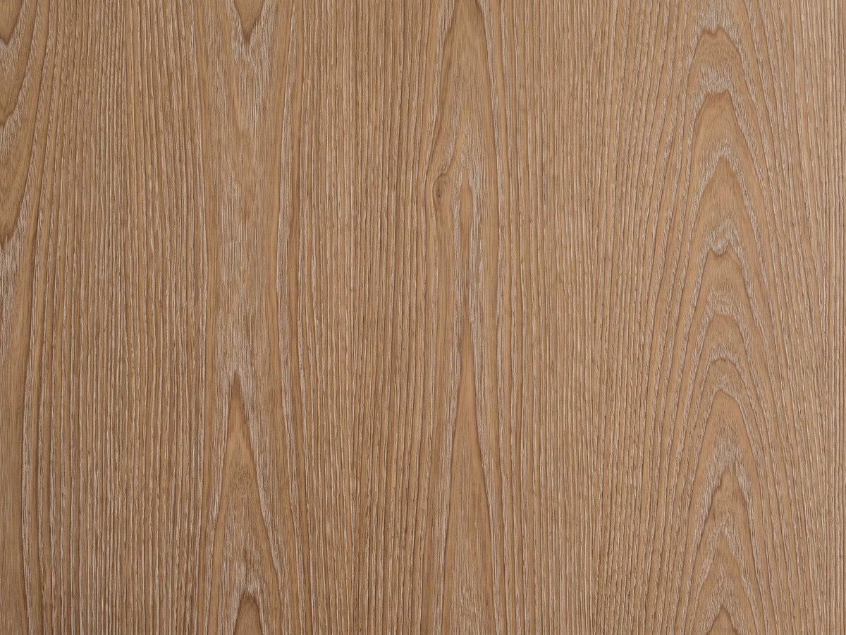 Close-up of the Mondovi 36-Inch Round Carved Limed Ash Drum Coffee Table: the limed ash grain of the round top