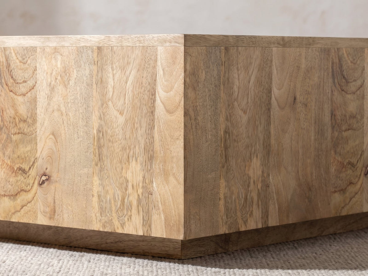 Close-up of the Montecatini Square Mango Coffee Table: the square corner of the mango block above its recessed plinth