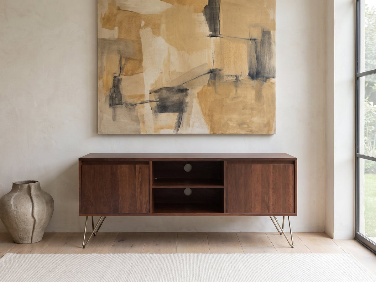 Montefalco Solid Mango Media Console under a large abstract painting in a bright living room