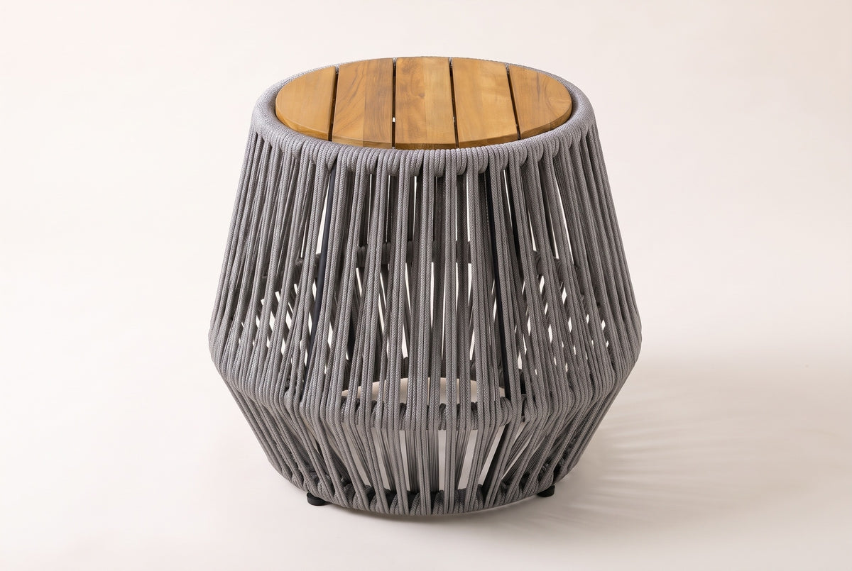 The Naro side table seen from the front: the round slatted top and the flared grey rope body